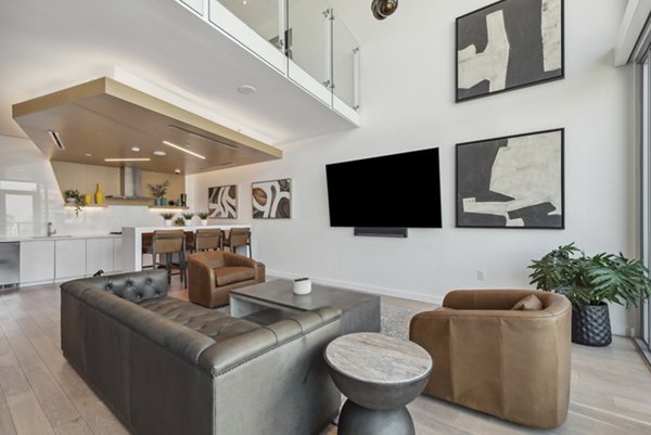 Modern clubhouse with lounge seating and community kitchen at K1 Apartments in the heart of San Diego