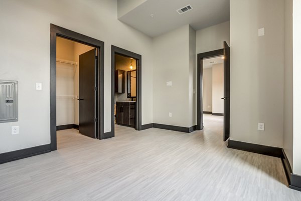 Cozy bedroom with modern decor at Centro Railyard Apartments