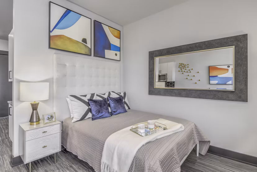 Modern bedroom with sleek furnishings at Centro Railyard Apartments