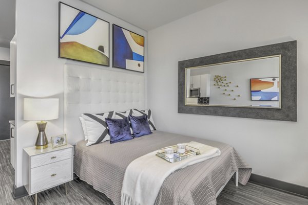 Modern bedroom with sleek furnishings at Centro Railyard Apartments