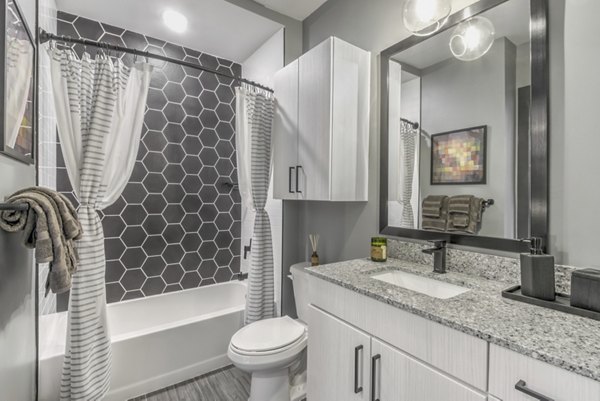 Bathroom featuring modern design and luxury finishes at Centro Railyard Apartments