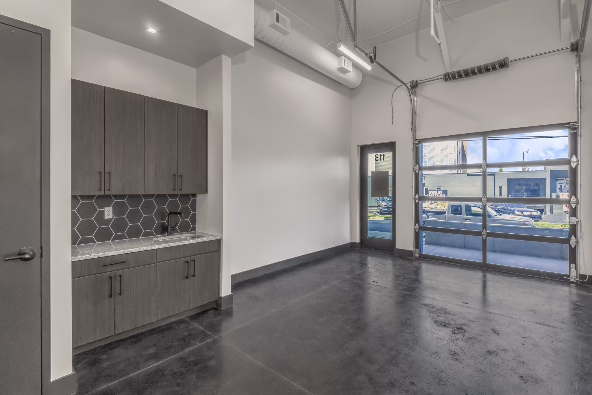 Clubhouse featuring modern design and ample seating at Centro Railyard Apartments