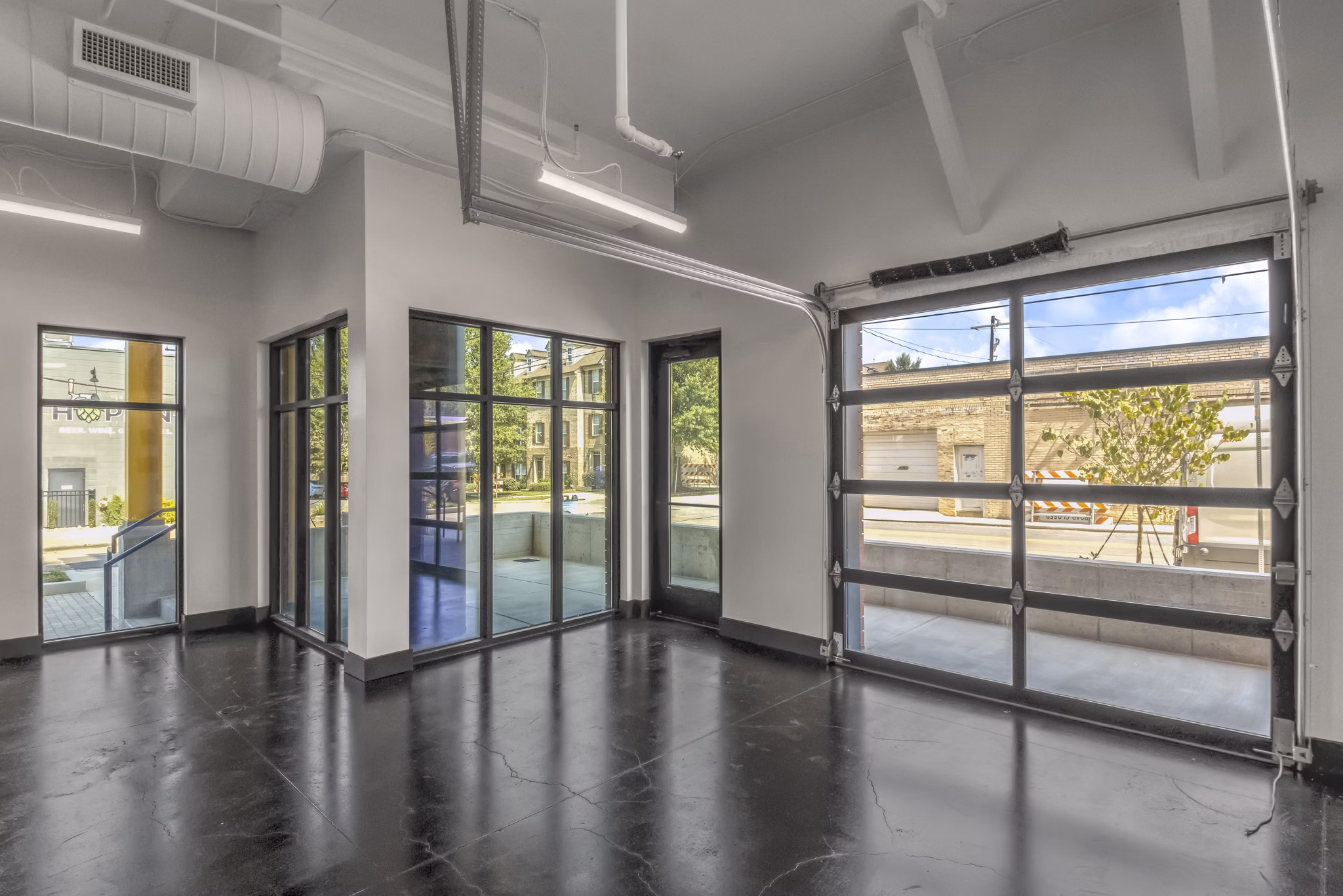Clubhouse with modern design and comfortable seating at Centro Railyard Apartments, ideal for social gatherings and community events
