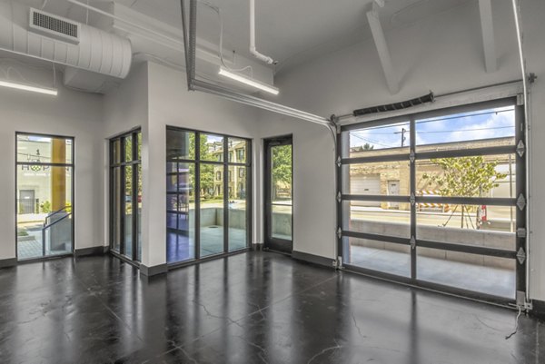 Clubhouse with modern design and comfortable seating at Centro Railyard Apartments, ideal for social gatherings and community events