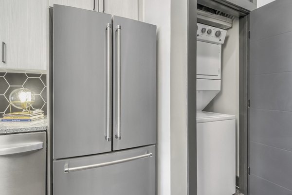 Modern kitchen with stainless steel appliances at Centro Railyard Apartments
