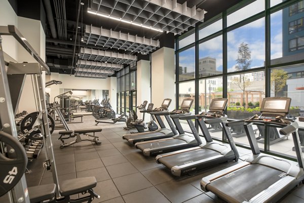 State-of-the-art fitness center with modern equipment at The Hamilton I Apartments, promoting active lifestyle and wellness