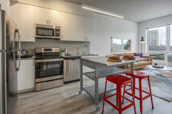 Modern kitchen with stainless steel appliances at The Hamilton I Apartments