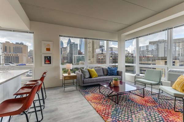 Modern living room with sleek furnishings at The Hamilton I Apartments Perfect for those seeking luxury and comfort in a vibrant community