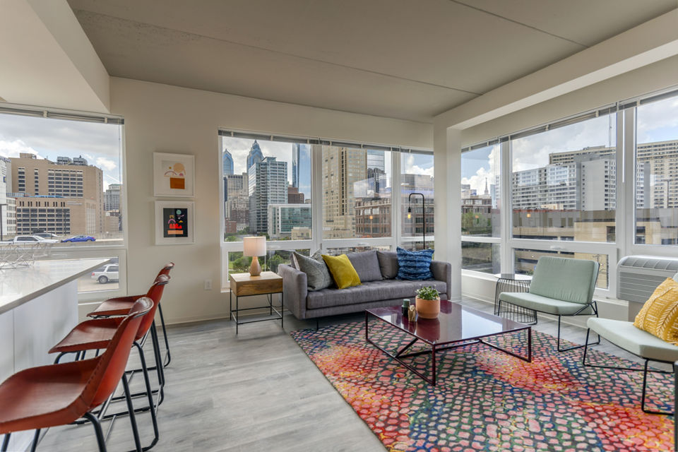 Modern living room with sleek furnishings at The Hamilton I Apartments Perfect for those seeking luxury and comfort in a vibrant community