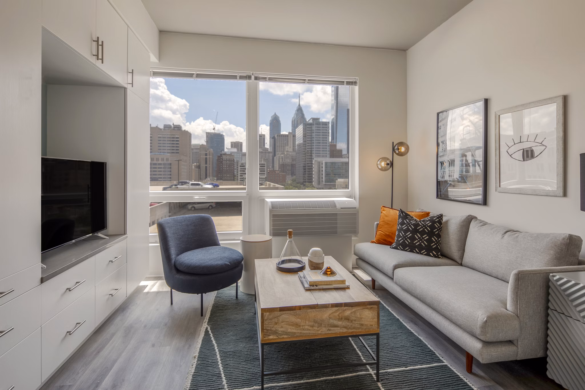Modern living room with designer furniture and stylish decor at The Hamilton I Apartments luxury residence