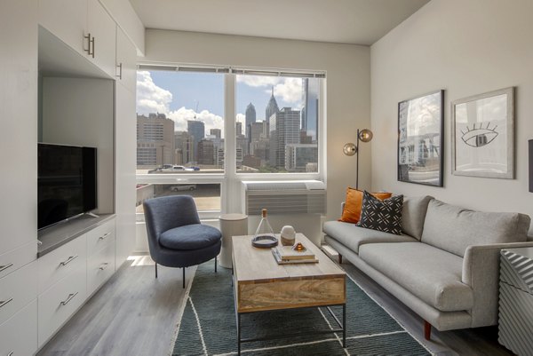 Modern living room with designer furniture and stylish decor at The Hamilton I Apartments luxury residence
