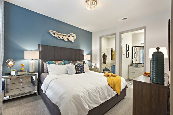 Cozy bedroom with stylish decor in Newbergh ATL Apartments