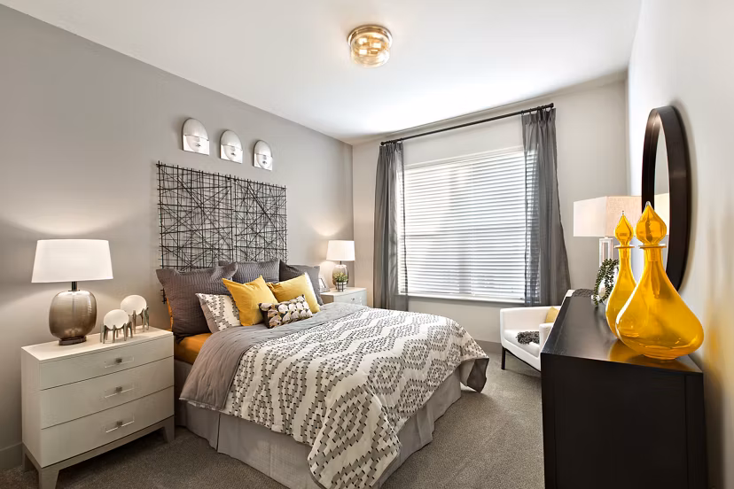 Bedroom with modern decor and plush bedding at Newbergh ATL Apartments