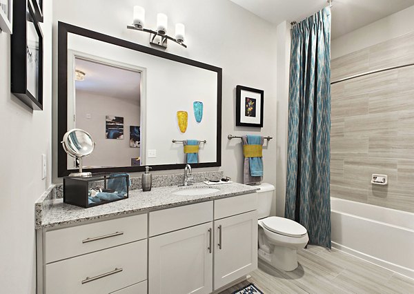 Modern bathroom with sleek fixtures at Newbergh ATL Apartments