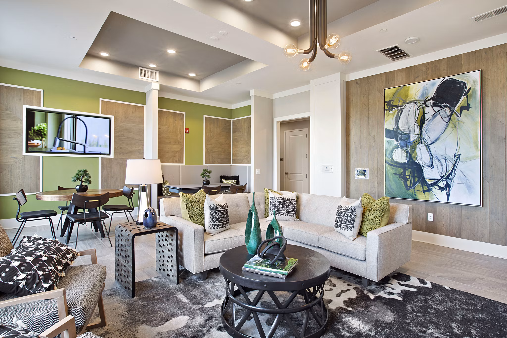 Clubhouse with modern design and seating areas at Newbergh ATL Apartments