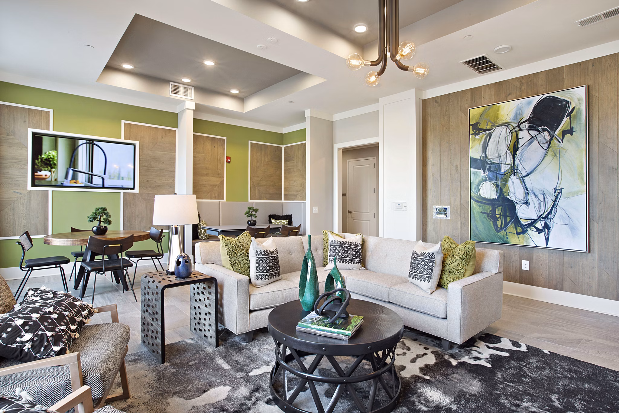 Clubhouse with modern design and seating areas at Newbergh ATL Apartments