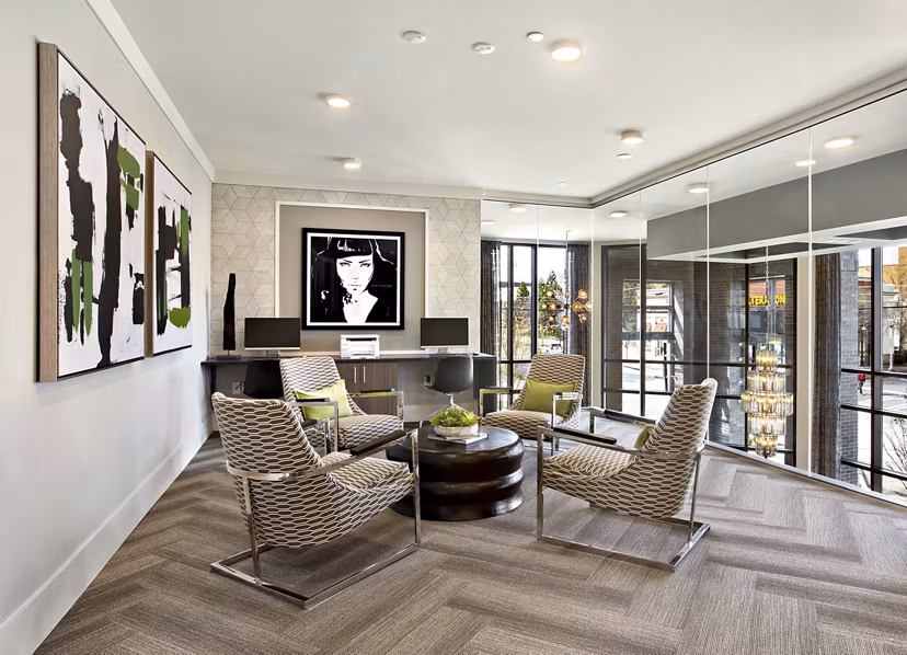 Modern business center with ergonomic seating at Newbergh ATL Apartments