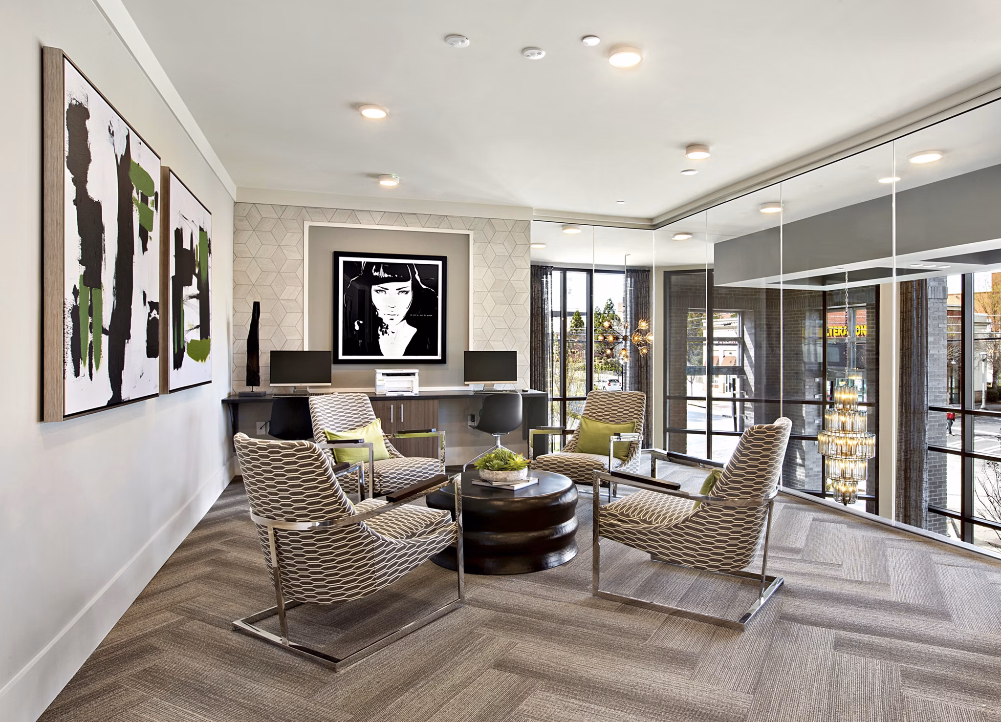 Modern business center with ergonomic seating at Newbergh ATL Apartments