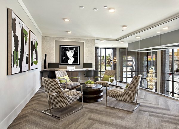 Modern business center with ergonomic seating at Newbergh ATL Apartments