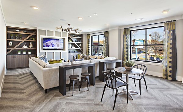 Newbergh ATL Apartments: Modern clubhouse with stylish seating areas and vibrant decor in Atlanta