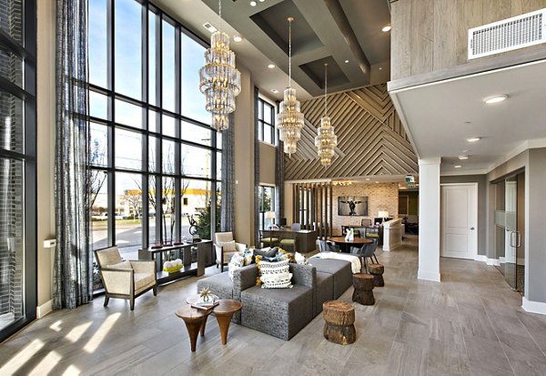 Clubhouse with modern decor and stylish seating at Newbergh ATL Apartments, ideal for social gatherings and relaxation