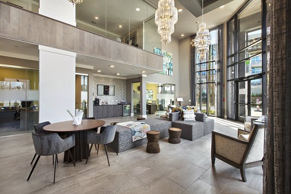 Clubhouse featuring modern decor and seating at Newbergh ATL Apartments