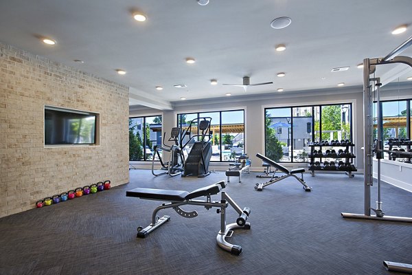 State-of-the-art fitness center at Newbergh ATL Apartments featuring modern gym equipment for residents' wellness and fitness goals