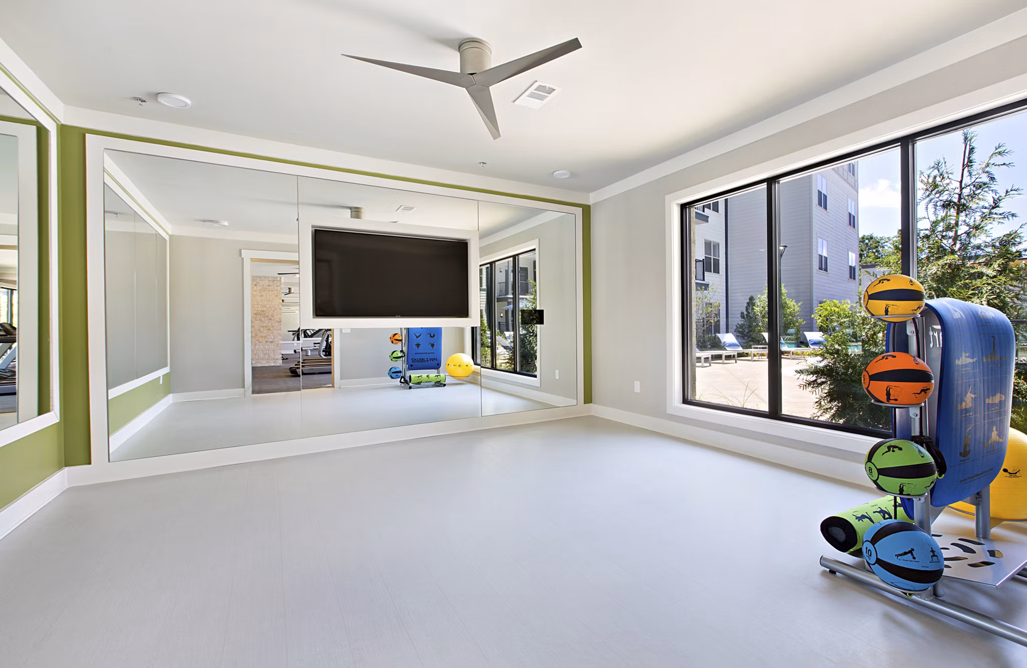 State-of-the-art fitness center with modern equipment at Newbergh ATL Apartments, ideal for health-conscious residents