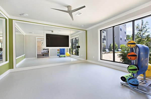 State-of-the-art fitness center with modern equipment at Newbergh ATL Apartments, ideal for health-conscious residents