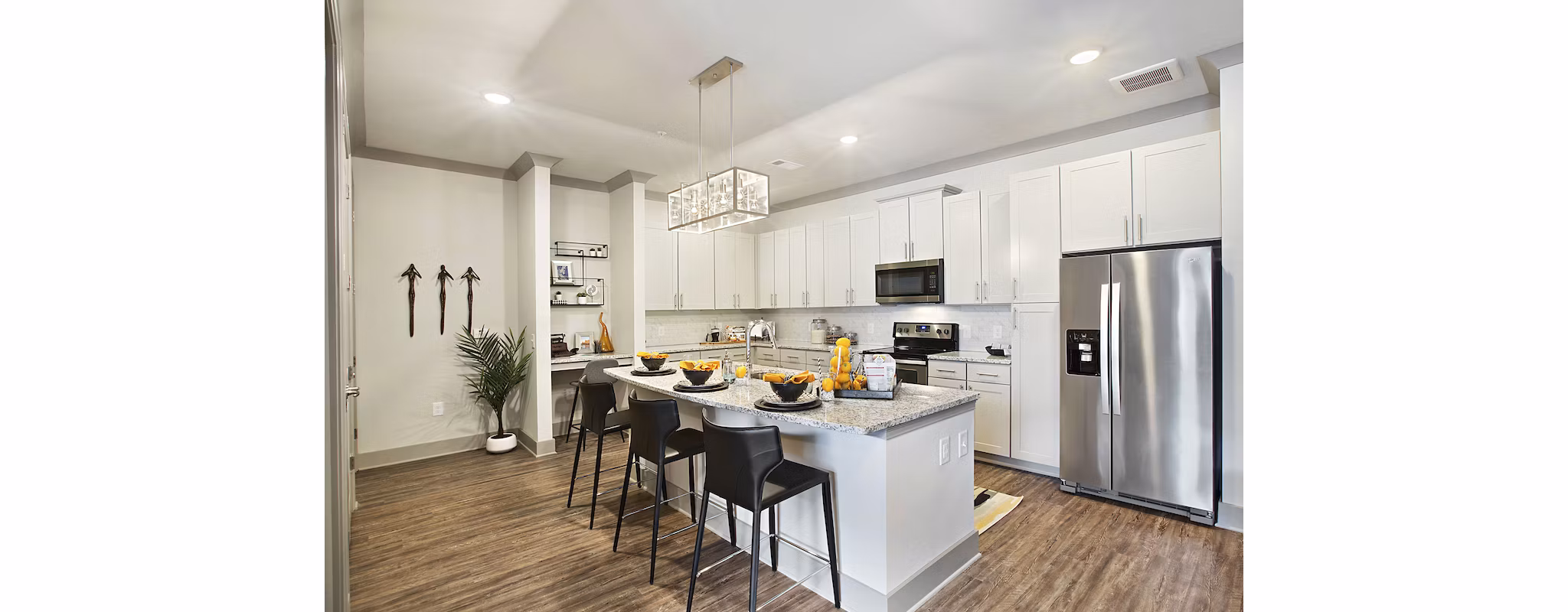 Modern kitchen with stainless steel appliances at Newbergh ATL Apartments
