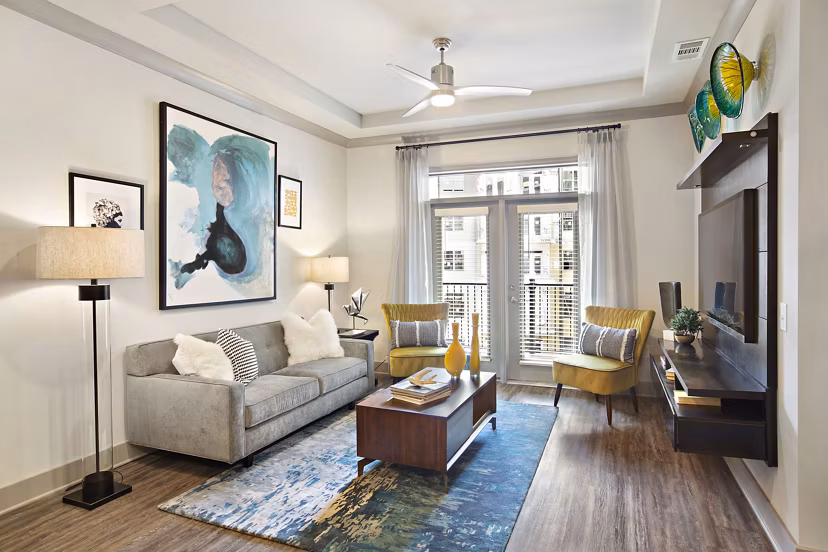 Modern living room with chic decor and plush seating at Newbergh ATL Apartments