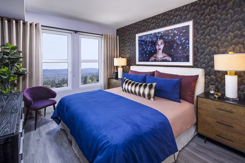 Elegant bedroom featuring modern decor and plush bedding at Highwater Apartments
