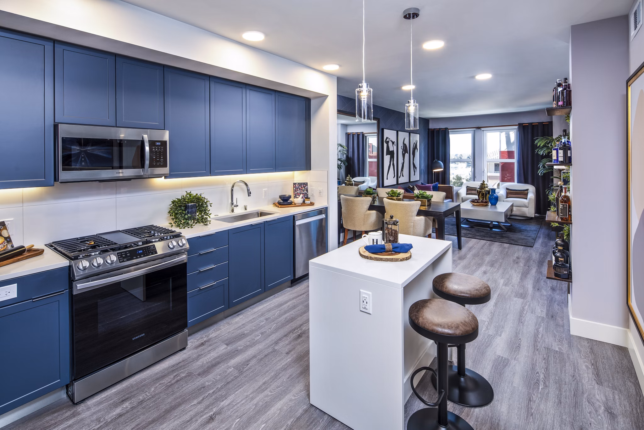 Modern kitchen with stainless steel appliances at Highwater Apartments, a luxury property by Greystar