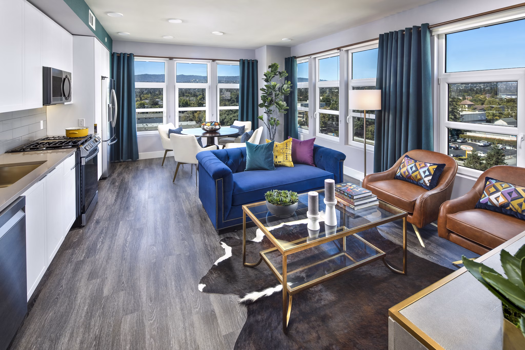 Spacious living room with modern decor and abundant natural light at Highwater Apartments