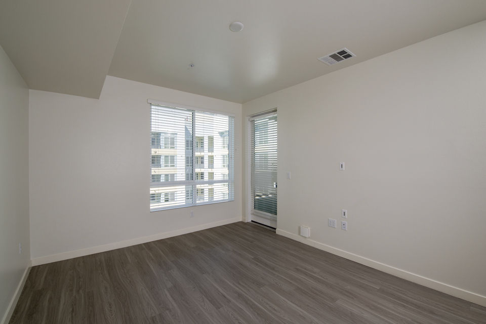 Spacious living room with modern decor at Parallel Apartments in a Greystar luxury community
