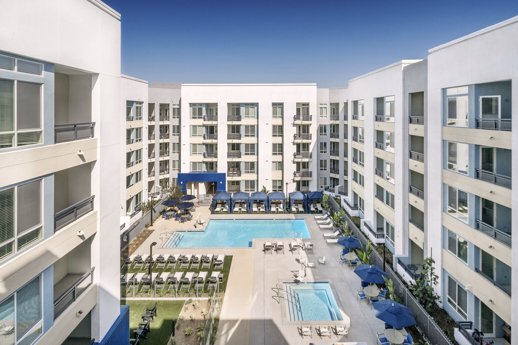 Modern pool with sun loungers at Parallel Apartments, a luxury  property