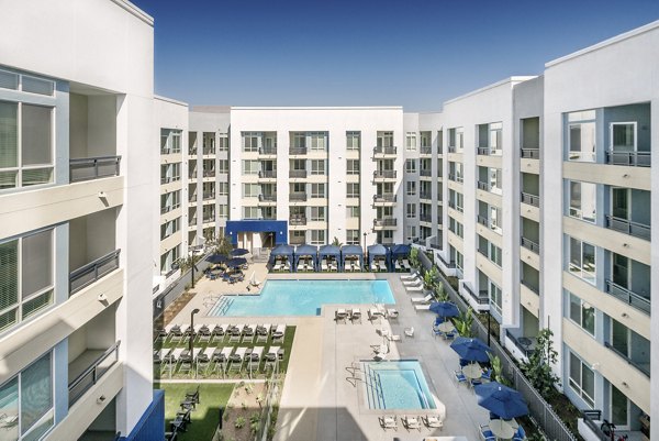 Modern pool with sun loungers at Parallel Apartments, a luxury  property