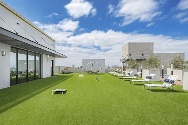 Parallel Apartments: Serene courtyard with landscaped gardens and seating areas