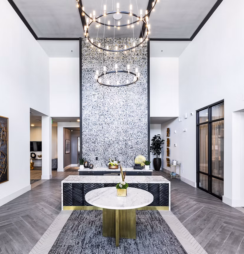 Clubhouse lobby featuring modern decor and seating at Overture River District Apartments, ideal for luxury living and social gatherings