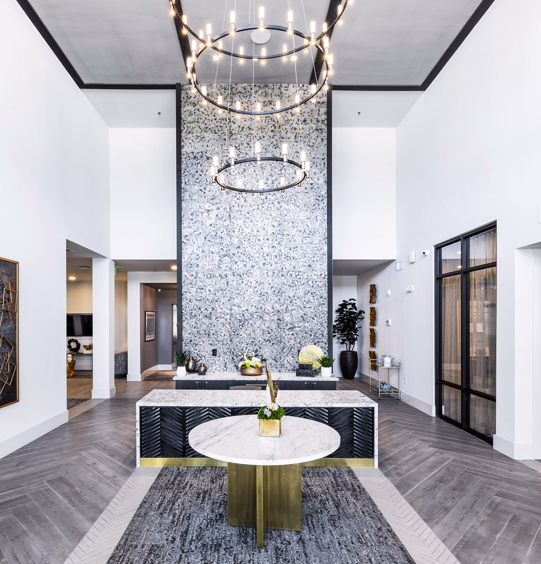 Clubhouse lobby featuring modern decor and seating at Overture River District Apartments, ideal for luxury living and social gatherings