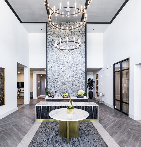 Clubhouse lobby featuring modern decor and seating at Overture River District Apartments, ideal for luxury living and social gatherings