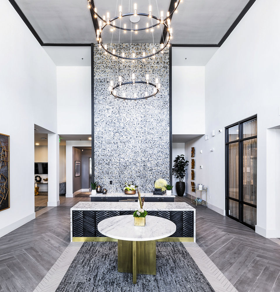 Clubhouse lobby featuring modern decor and seating at Overture River District Apartments, ideal for luxury living and social gatherings