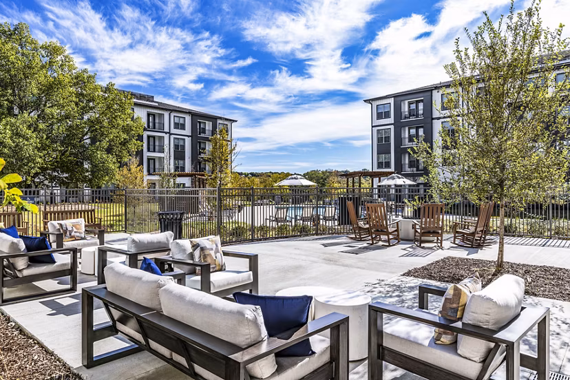 Modern patio with cozy seating at Overture River District Apartments