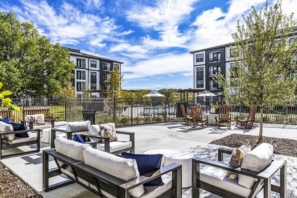 Modern patio with cozy seating at Overture River District Apartments