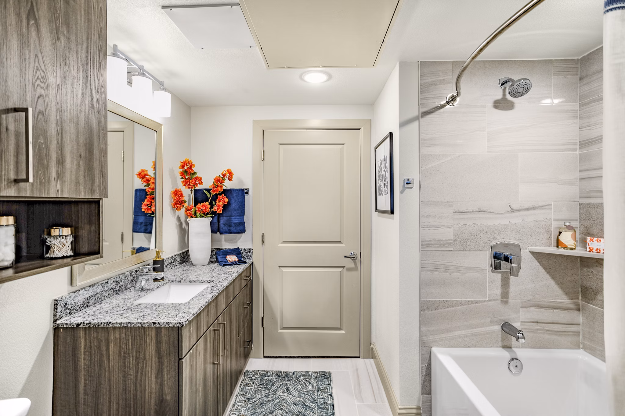 Elegant bathroom with modern fixtures at Domain Town Center Apartments, featuring porcelain tiles and spacious vanity