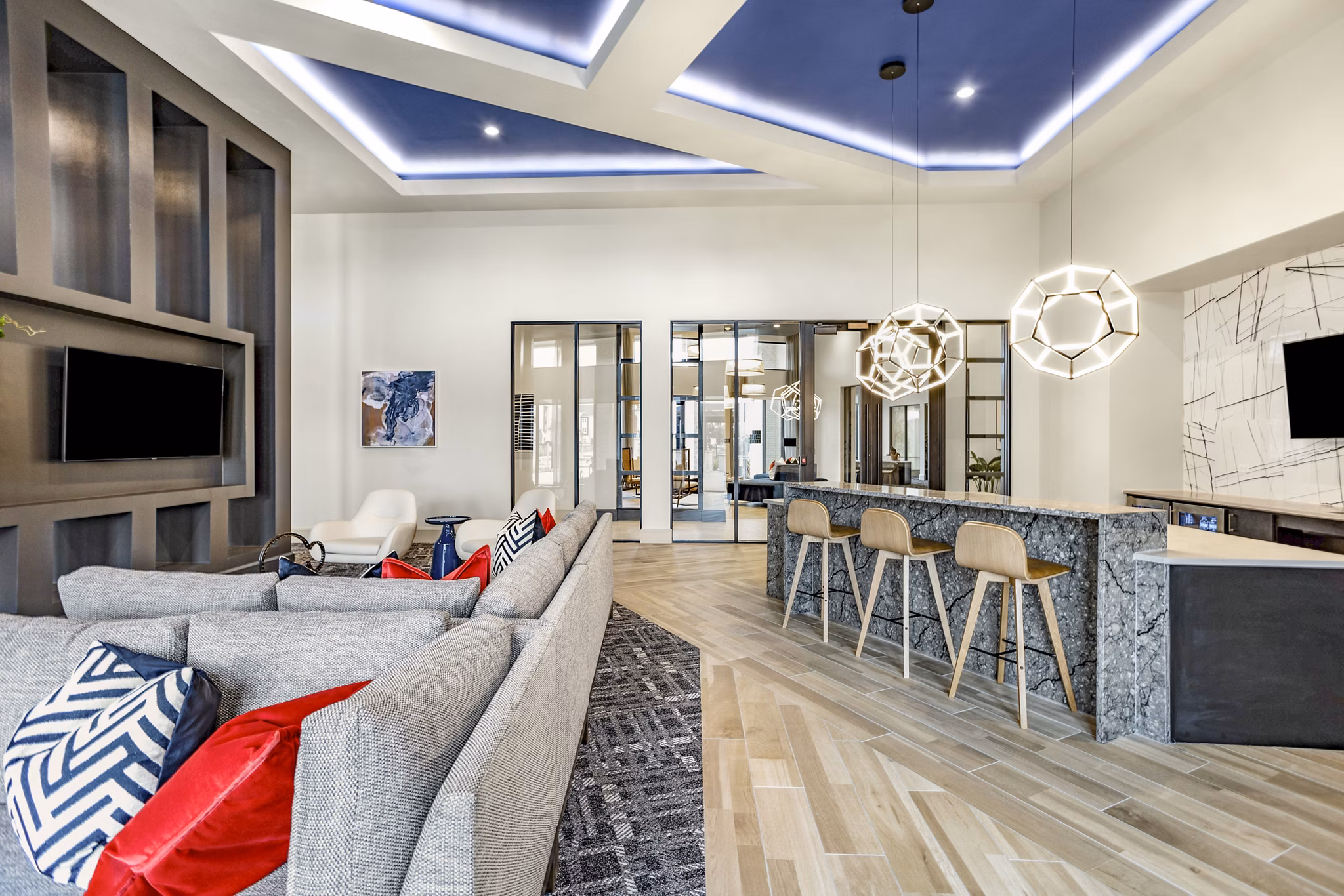 Spacious clubhouse with modern seating and entertainment areas at Domain Town Center Apartments