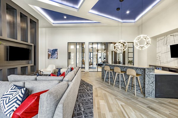 Spacious clubhouse with modern seating and entertainment areas at Domain Town Center Apartments