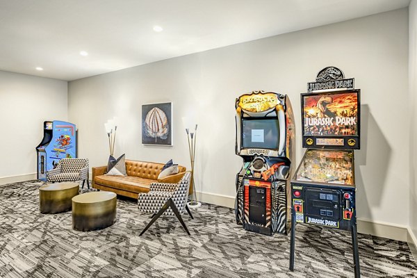 Clubhouse with modern furnishings at Domain Town Center Apartments featuring a spacious layout ideal for residents' gatherings