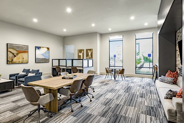 Elegant clubhouse at Domain Town Center Apartments featuring modern design and spacious seating areas for social gatherings