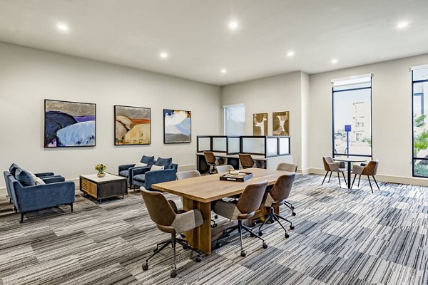 Modern clubhouse with pool table and lounge seating at Domain Town Center Apartments